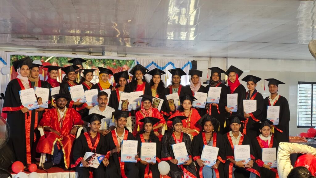Group of students in graduation gowns holding certificates during the LCC Nilambur convocation ceremony, celebrating academic success and achievements.